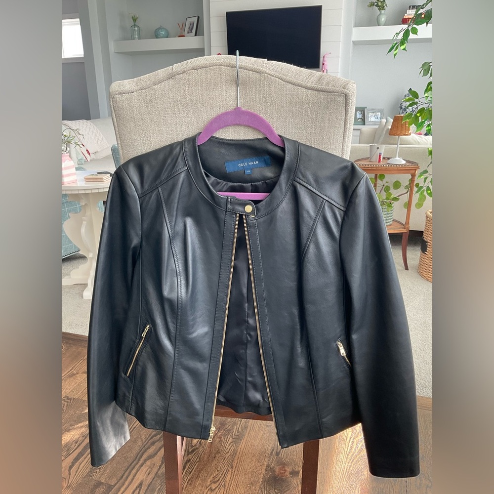 Black Cole Haan Leather Jacket with Gold details.